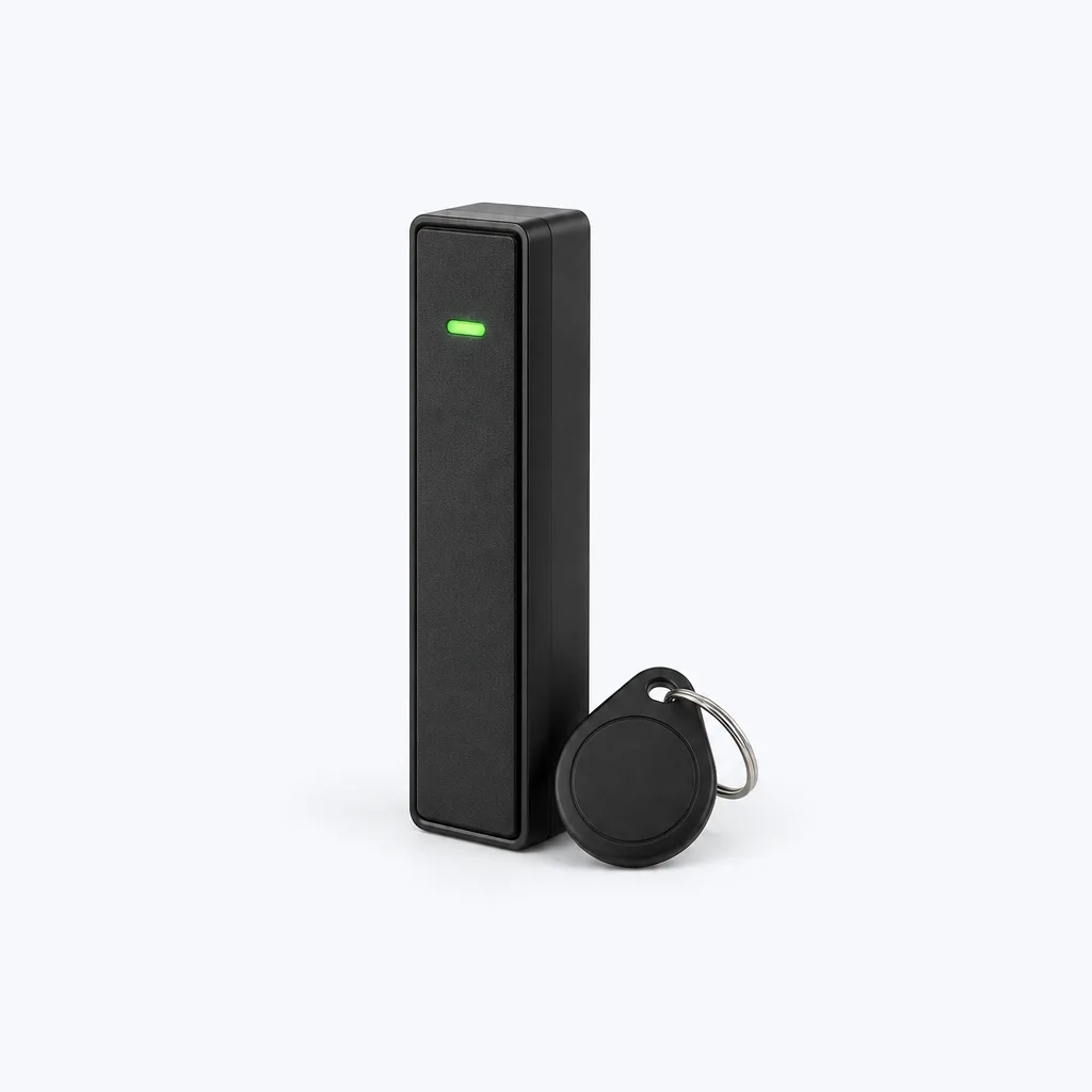 A slim black access control card reader with a key fob