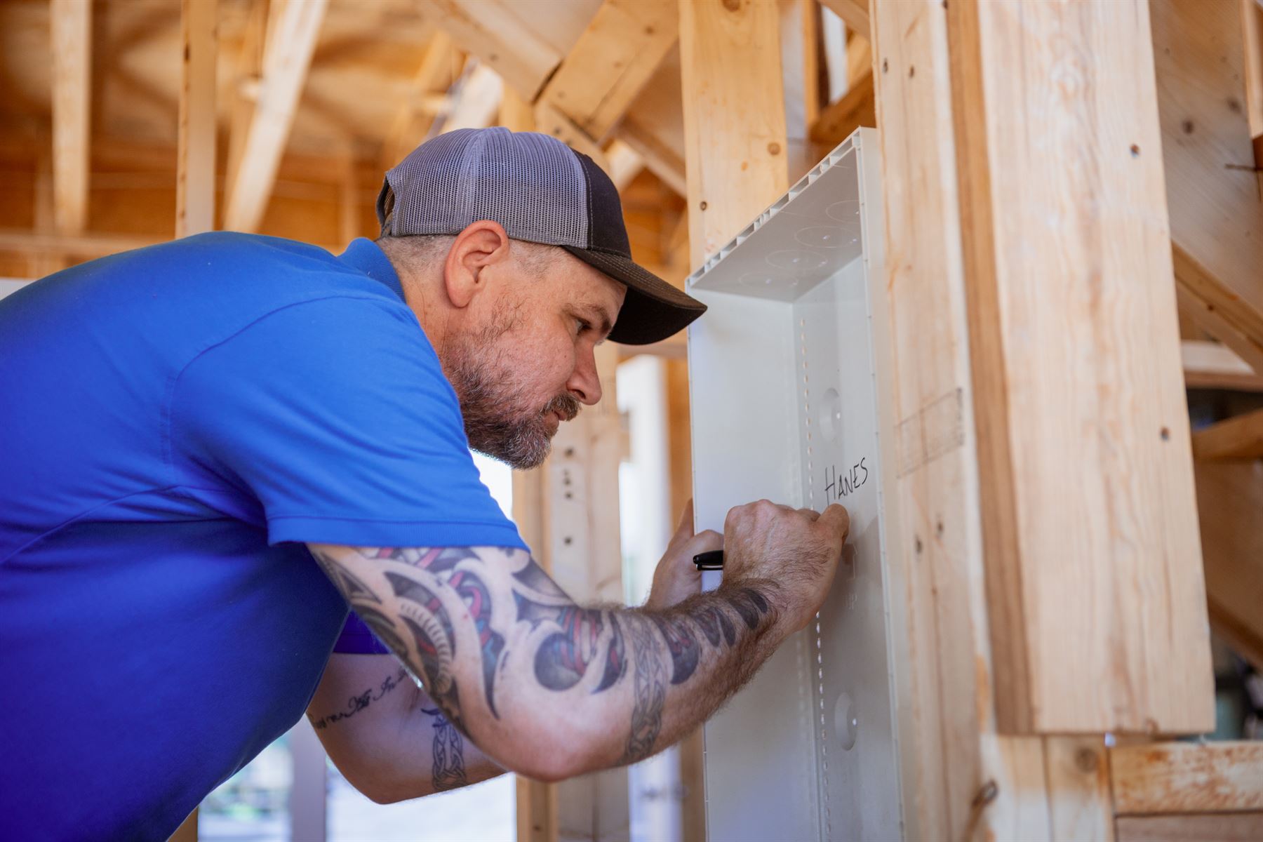 Technician labeling a structured media enclosure